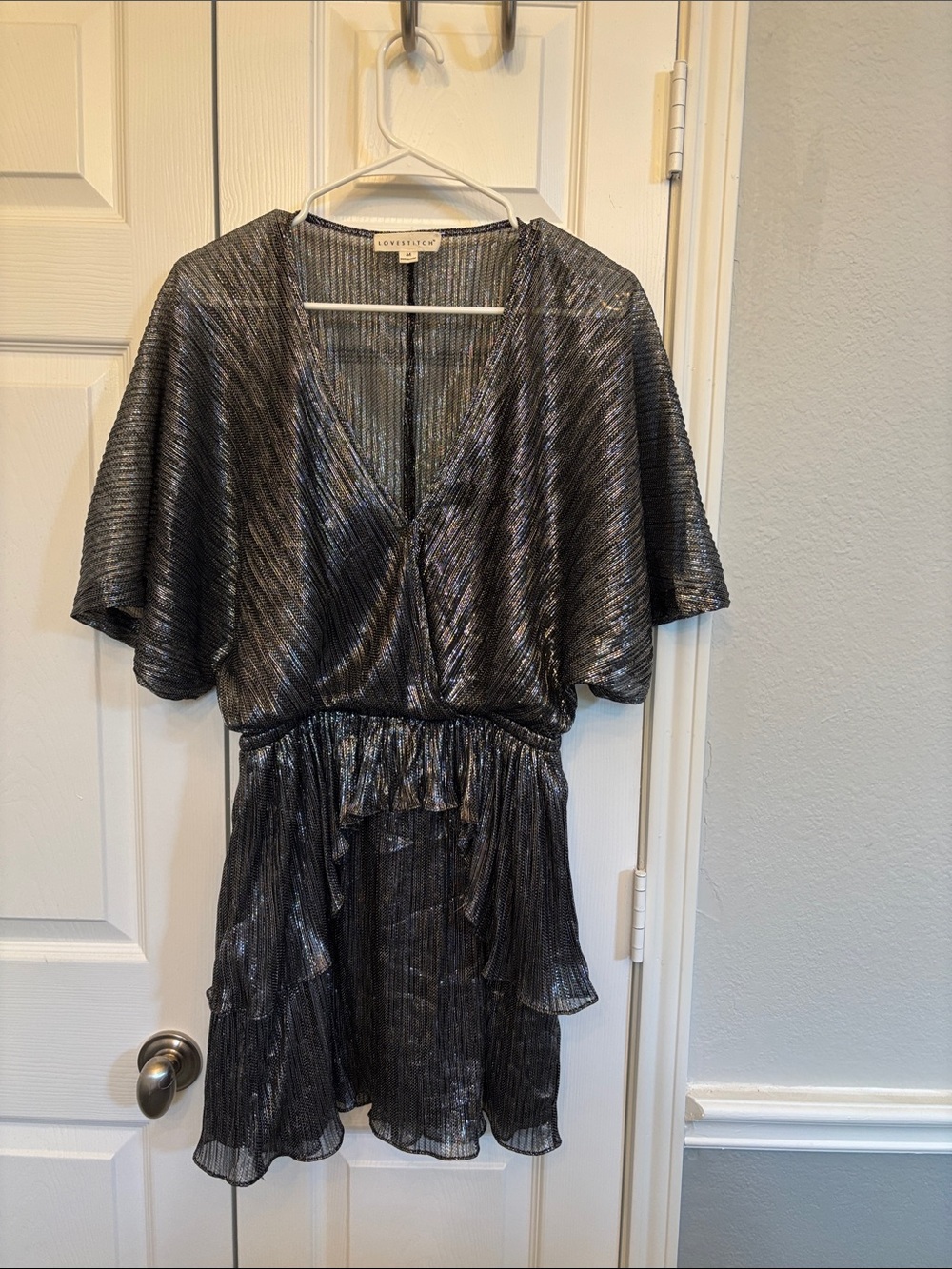 Love Stitch Metallic Black V-Neck Ruffle Mini Dress